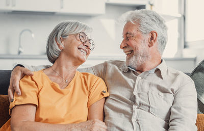 Side view of senior couple sitting at home