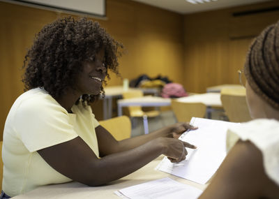 Side view of woman using mobile phone