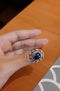 Close-up of human hand holding ring