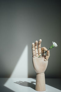 Close-up of vase on table against white background