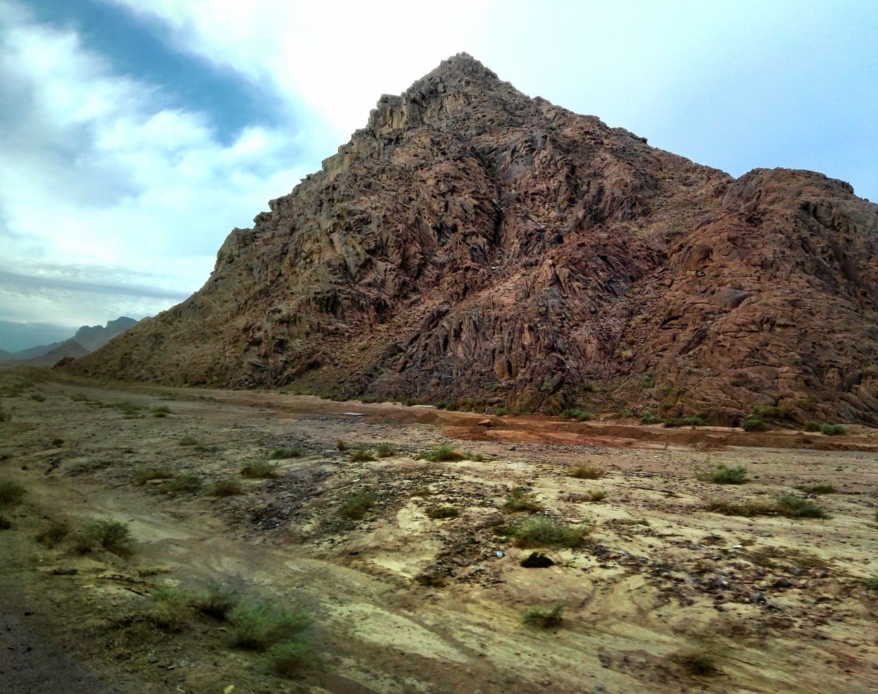 mountain, geology, nature, landscape, sky, rock formation, physical geography, rock - object, day, outdoors, tranquility, beauty in nature, scenics, cloud - sky, tranquil scene, no people, volcanic landscape