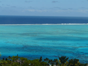 Scenic view of sea against blue sky