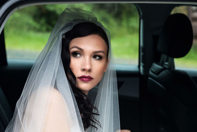 Portrait of woman in car