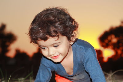 Beautiful indian little kid's face and sunset background , india