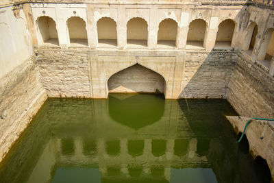 Reflection of old building in water