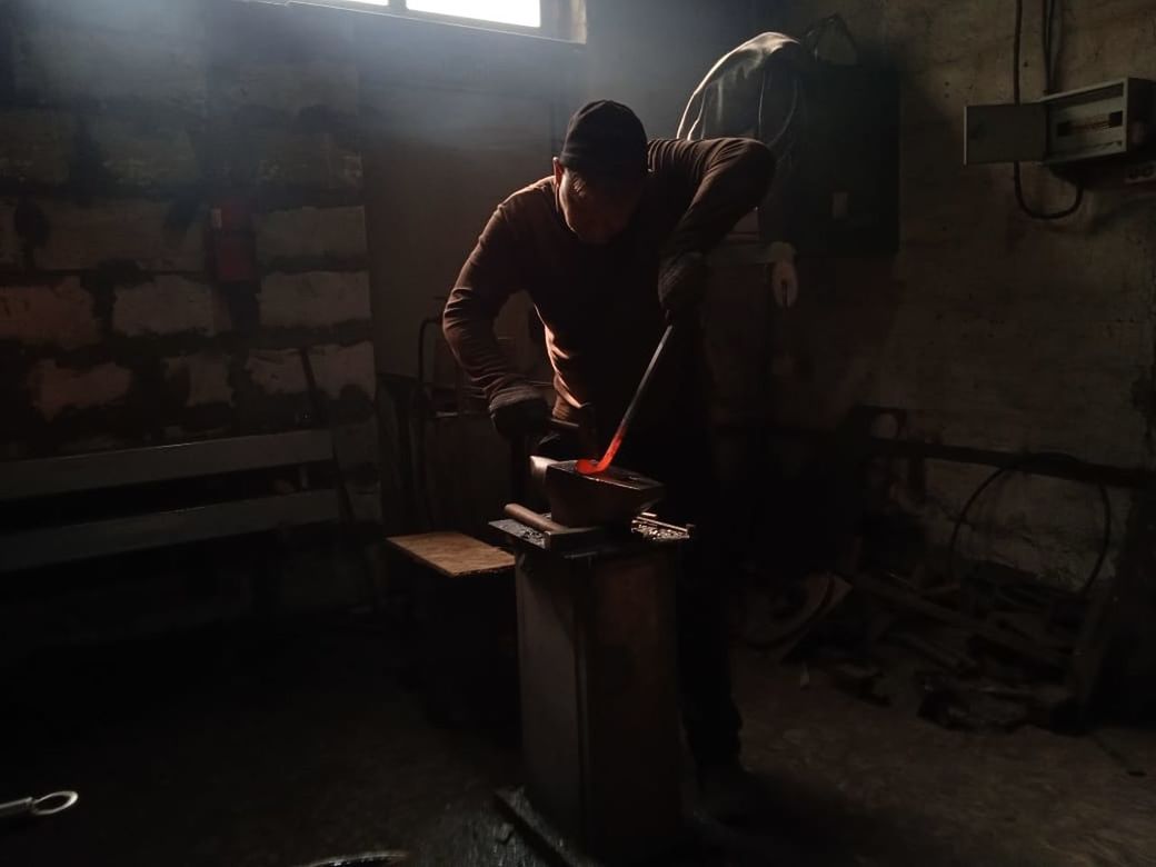 one person, adult, indoors, darkness, occupation, workshop, skill, men, working, screenshot, metal industry, standing, young adult, industry, black, light, performance art, full length, manual worker, person