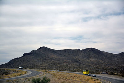 Scenic view of mountain road against sky