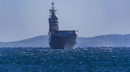 Ship in sea against clear sky