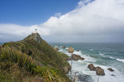 The iconic and historical nugget point light house in new zealand.