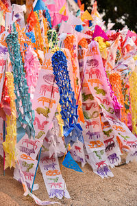 Close-up of multi colored decorations for sale at market stall