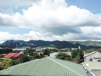 Houses in town against sky