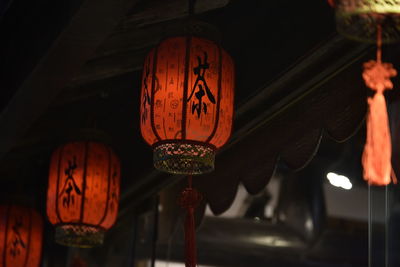 Low angle view of chinese lanterns hanging from ceiling