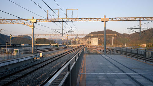 Railroad tracks against clear sky