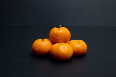 Close-up of orange fruits on table