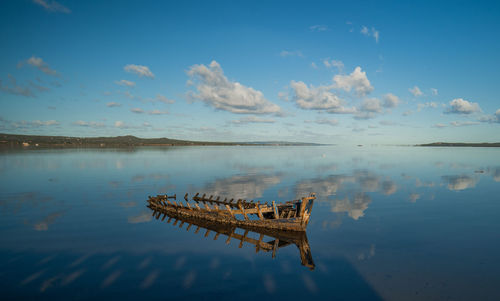 Boat in the water. fishing boat in the calm waters of the pond santa caterina in southern sardinia