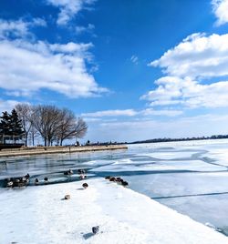 Scenic view of frozen lake against sky