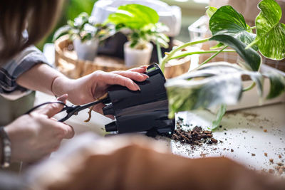 Cropped hand of man working at home