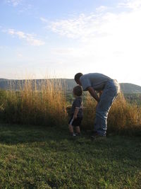 Man on field against sky