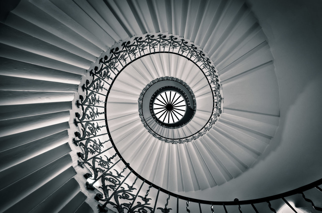 indoors, spiral staircase, steps and staircases, ceiling, staircase, pattern, steps, spiral, directly below, architecture, built structure, circle, railing, design, geometric shape, low angle view, skylight, architectural feature, diminishing perspective, repetition