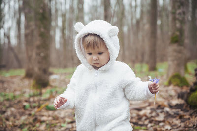 Portrait of girl standing in forest