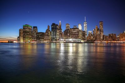 Illuminated buildings in city at night