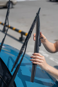 Person holding a ship in water