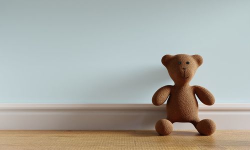 Close-up of toy on table against wall at home