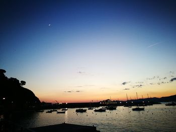 Scenic view of sea against clear sky during sunset