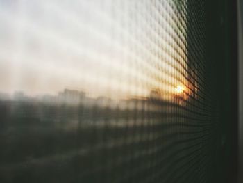 View of sunset seen through window