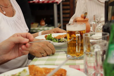 Midsection of man preparing food in restaurant