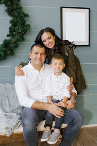 Happy family spend time together on christmas. portrait of mom dad and son on winter holiday