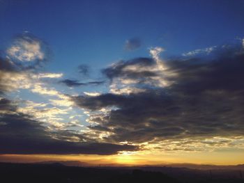 Scenic view of landscape against cloudy sky