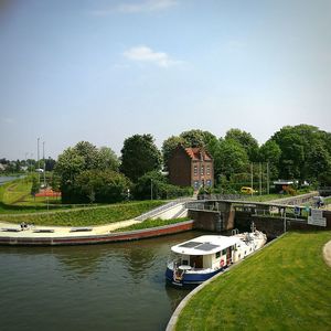 Boats moored in river