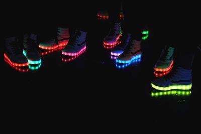 Low section of illuminated neon shoes