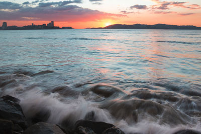 Scenic view of sea against sky during sunset