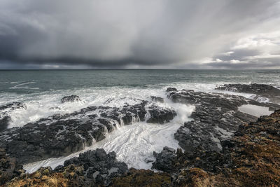 Waves splashing on rocks