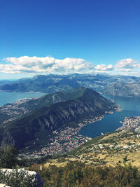 High angle view of mountains against blue sky