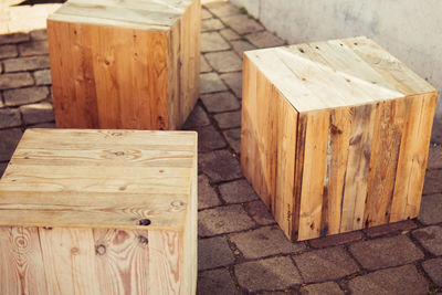 High angle view of wooden blocks on footpath