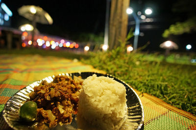 Close-up of food on table at night