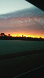 Scenic view of landscape against dramatic sky