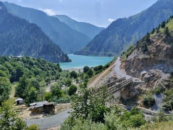 Scenic view of lake and mountains against sky