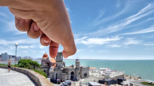 Close-up of a man with cityscape in the background