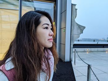 Portrait of beautiful young woman looking away