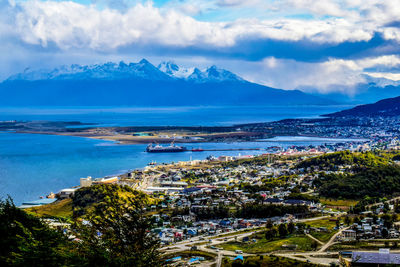 High angle view of buildings and sea against sky