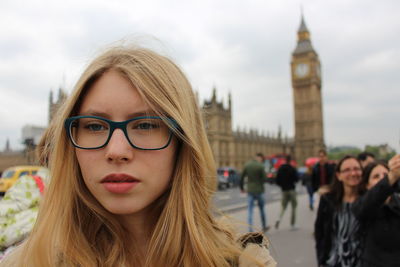 Portrait of young woman in front of big ben