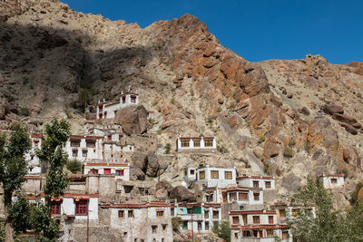 Houses in town against clear sky