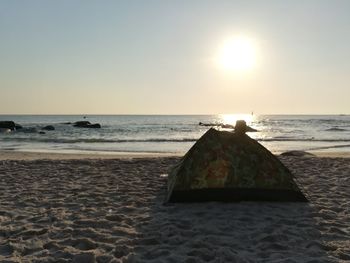 Scenic view of sea against clear sky during sunset