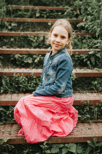 Happy candid kid girl on staircase. prepubertal age of children mind psychology and mental health