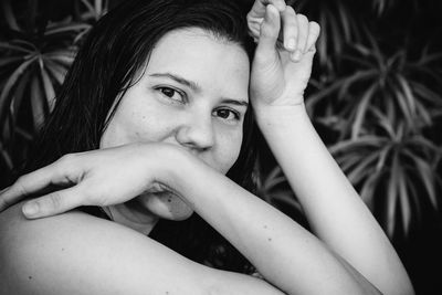 Close-up portrait of smiling young woman