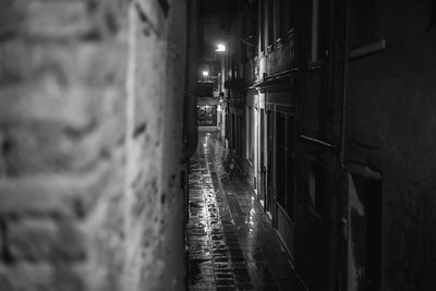 Narrow alley in city at night